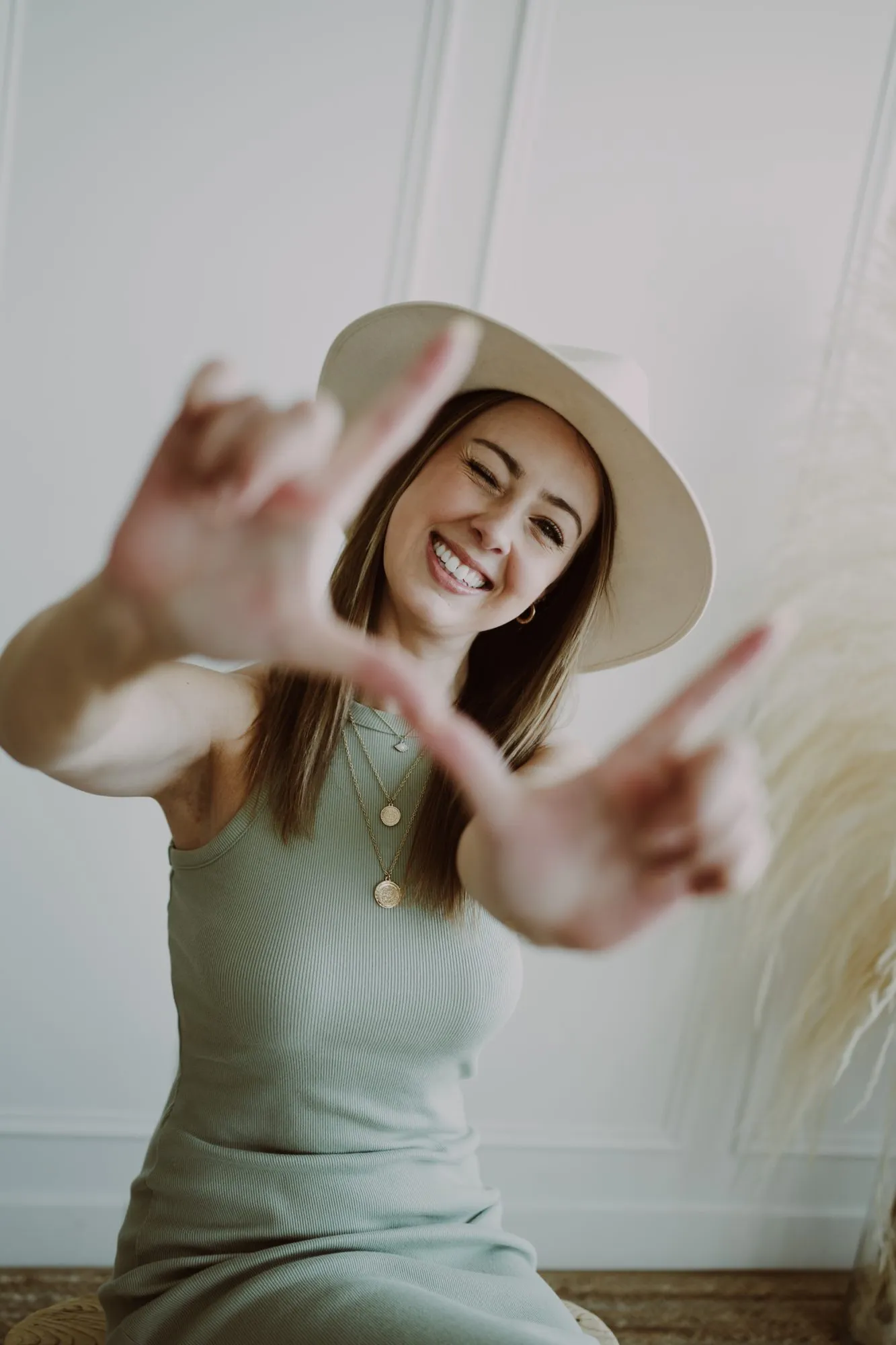Shelby smiling and framing the camera with her hands